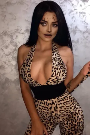 METISHA looking sexy as she holds the tail of her leopard print outfit