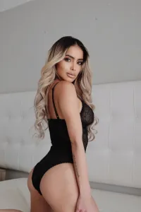 Dani wearing black lingerie showing off her round ass